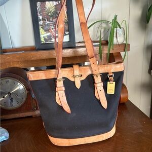 Dooney & Bourke Black and Tan Leather Trim Bucket